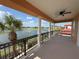 Spacious balcony with views of a lake, golf course, and palm trees at 1554 Corolla Ct, Reunion, FL 34747