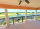 Expansive balcony showcasing picturesque views of the lush golf course and serene water features beyond at 1554 Corolla Ct, Reunion, FL 34747