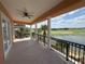 Expansive balcony offering panoramic views of the lake and lush golf course at 1554 Corolla Ct, Reunion, FL 34747