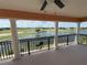 An impressive view from the balcony overlooking the golf course and lake at 1554 Corolla Ct, Reunion, FL 34747