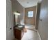 Bathroom featuring a vanity and shower/tub at 1554 Corolla Ct, Reunion, FL 34747