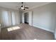 Bedroom featuring a ceiling fan and closet at 1554 Corolla Ct, Reunion, FL 34747