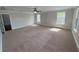 A large bedroom with carpet and ceiling fan at 1554 Corolla Ct, Reunion, FL 34747