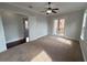 Bedroom featuring a ceiling fan and balcony at 1554 Corolla Ct, Reunion, FL 34747