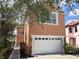 Home with white garage door and neutral, earth-toned paint at 1554 Corolla Ct, Reunion, FL 34747
