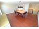 Well-lit game room with a pool table and hardwood floors, ideal for recreation and leisure at 1554 Corolla Ct, Reunion, FL 34747