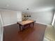 A game room with a pool table and hardwood flooring at 1554 Corolla Ct, Reunion, FL 34747