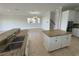 Bright kitchen features granite countertops, stainless steel appliances, and an island at 1554 Corolla Ct, Reunion, FL 34747