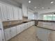 Bright kitchen features granite countertops, stainless steel appliances, and an island at 1554 Corolla Ct, Reunion, FL 34747