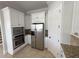 Bright kitchen features granite countertops, stainless steel appliances, and modern cabinetry at 1554 Corolla Ct, Reunion, FL 34747