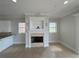 Cozy living room featuring a fireplace, neutral color palette, and lots of natural light at 1554 Corolla Ct, Reunion, FL 34747