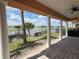 Covered patio features brick flooring and views of a fountain on the lake and a beautiful golf course at 1554 Corolla Ct, Reunion, FL 34747