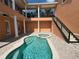 Lovely courtyard pool area with upstairs balcony overlooking the pool at 1554 Corolla Ct, Reunion, FL 34747