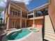Lovely courtyard pool area with upstairs balcony overlooking the pool at 1554 Corolla Ct, Reunion, FL 34747