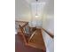 A wooden staircase with an iron railing at 1554 Corolla Ct, Reunion, FL 34747