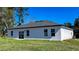 Exterior back view of a single-Gathering home with a spacious backyard at 16358 Sw 27Th Terrace Rd, Ocala, FL 34473