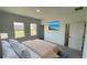 Cozy bedroom with ample natural light, neutral paint, and an attached bathroom at 16358 Sw 27Th Terrace Rd, Ocala, FL 34473
