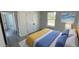 Well-lit bedroom featuring a window, closet with double doors and stylish decor at 16358 Sw 27Th Terrace Rd, Ocala, FL 34473