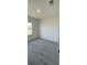 Neutral bedroom featuring a window and gray floors at 16358 Sw 27Th Terrace Rd, Ocala, FL 34473