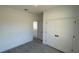 Neutral bedroom with gray floors and a closet with double doors at 16358 Sw 27Th Terrace Rd, Ocala, FL 34473
