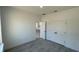 Neutral bedroom featuring a closet with double doors and gray floors at 16358 Sw 27Th Terrace Rd, Ocala, FL 34473