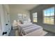 Well-lit bedroom featuring multiple windows and stylish decor at 16358 Sw 27Th Terrace Rd, Ocala, FL 34473
