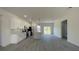 Bright kitchen features a kitchen island, stainless steel appliances, and modern pendant lighting at 16358 Sw 27Th Terrace Rd, Ocala, FL 34473