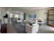 Modern living room with contemporary furniture and decor, featuring wood-look flooring and neutral color palette at 16358 Sw 27Th Terrace Rd, Ocala, FL 34473