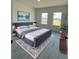 Inviting main bedroom with comfortable furnishings, calming decor, and plenty of natural light at 16358 Sw 27Th Terrace Rd, Ocala, FL 34473