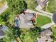 Overhead view of home with pool, landscaped yard, and manicured grounds, offering privacy and space at 205 Torcaso Ct, Winter Springs, FL 32708