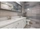 Contemporary bathroom features double sinks, stylish tile, a stand alone toilet, and a walk-in shower at 205 Torcaso Ct, Winter Springs, FL 32708