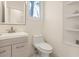 Bright bathroom featuring a modern vanity and toilet with a built in shelving unit next to the toilet at 205 Torcaso Ct, Winter Springs, FL 32708