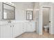 A bright bathroom with dual sinks, marble countertops, and an enclosed toilet area at 205 Torcaso Ct, Winter Springs, FL 32708