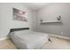 Minimalist bedroom with a simple decor and a large bed, offering a serene and uncluttered space at 205 Torcaso Ct, Winter Springs, FL 32708