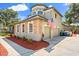Charming two-story home with a well-maintained exterior, attached garages, and landscaped surroundings at 205 Torcaso Ct, Winter Springs, FL 32708