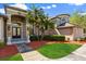 Stunning home featuring lush landscaping, manicured lawn, and an inviting front entry at 205 Torcaso Ct, Winter Springs, FL 32708