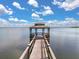 Picturesque gazebo at the end of a dock, perfect for relaxing and taking in the expansive water views at 205 Torcaso Ct, Winter Springs, FL 32708