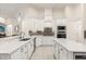 Modern kitchen featuring white cabinets, stainless steel appliances, and a center island at 205 Torcaso Ct, Winter Springs, FL 32708
