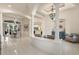 Spacious living area with tile floors, columns, chandelier, and open floor plan at 205 Torcaso Ct, Winter Springs, FL 32708