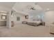 Open main bedroom with natural lighting, ensuite bathroom, and sitting area at 205 Torcaso Ct, Winter Springs, FL 32708