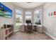 Office space with a large window area for natural light, a desk, and shelving for storage and organization at 205 Torcaso Ct, Winter Springs, FL 32708