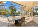 Covered patio featuring a dining area, overlooking the pool, and serene outdoor living space at 205 Torcaso Ct, Winter Springs, FL 32708
