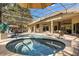 Inviting screened-in pool and spa with ample seating, perfect for relaxing and entertaining outdoors at 205 Torcaso Ct, Winter Springs, FL 32708