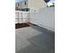 Enclosed backyard with a white fence surrounding the property and small flower bed with stepping stones at 247 Debora Ct # 1, Altamonte Springs, FL 32701