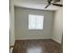 This bedroom offers hardwood floors, a ceiling fan, and a window letting in plenty of light at 247 Debora Ct # 1, Altamonte Springs, FL 32701