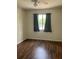 Comfortable bedroom with hardwood floors and a bright window at 247 Debora Ct # 1, Altamonte Springs, FL 32701