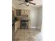 Efficient kitchen layout with stainless steel appliances, tiled backsplash, and convenient access at 247 Debora Ct # 1, Altamonte Springs, FL 32701