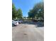 A parking lot with plenty of parking spaces surrounded by luscious trees and green grass at 247 Debora Ct # 1, Altamonte Springs, FL 32701