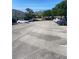 A parking lot with plenty of parking spaces surrounded by luscious trees and green grass at 247 Debora Ct # 1, Altamonte Springs, FL 32701