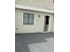 Gray back patio with a window and a door that leads into the house at 247 Debora Ct # 1, Altamonte Springs, FL 32701